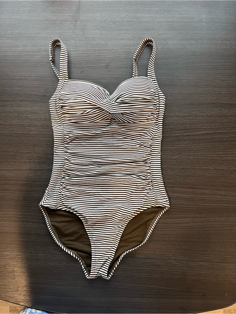 Nip Tuck Swim
One Piece
Twisted & Ruched Front Brown and White